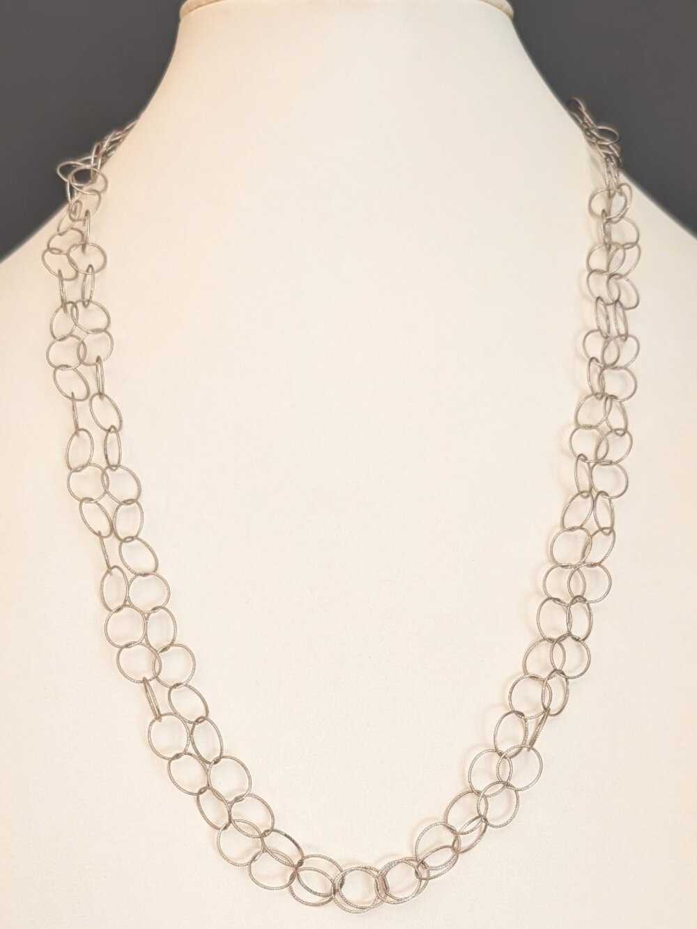 Long delicate textured silver circle necklace